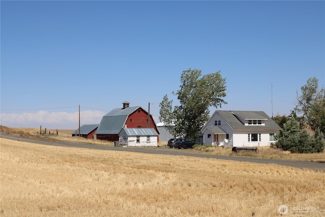 view of yard featuring an outbuilding and a barn