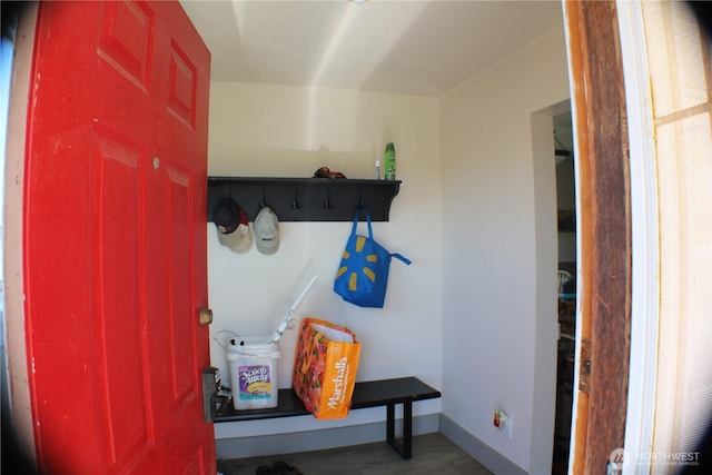 mudroom featuring wood finished floors and baseboards