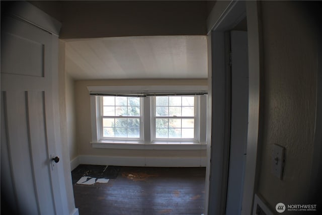 interior space with wood finished floors and baseboards