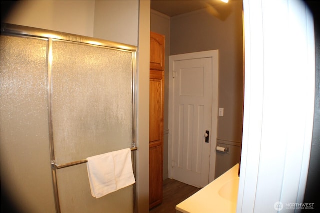 full bath with a shower stall and vanity