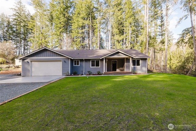 single story home featuring board and batten siding, concrete driveway, a garage, and a front yard