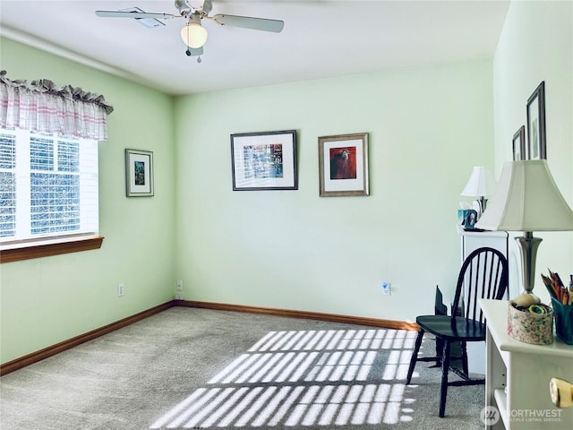unfurnished room featuring baseboards, ceiling fan, and carpet floors