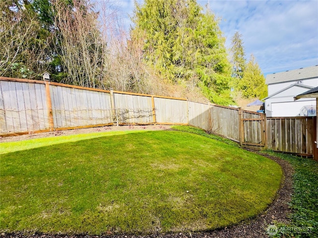 view of yard with a fenced backyard