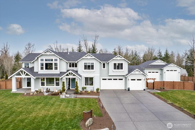 view of front of home featuring a shingled roof, concrete driveway, a front yard, and fence