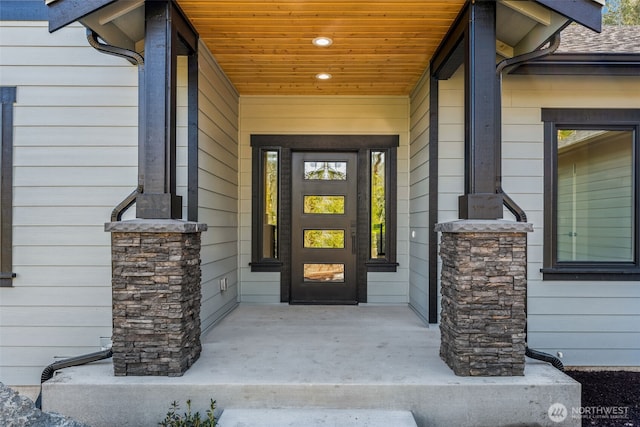 entrance to property featuring a porch