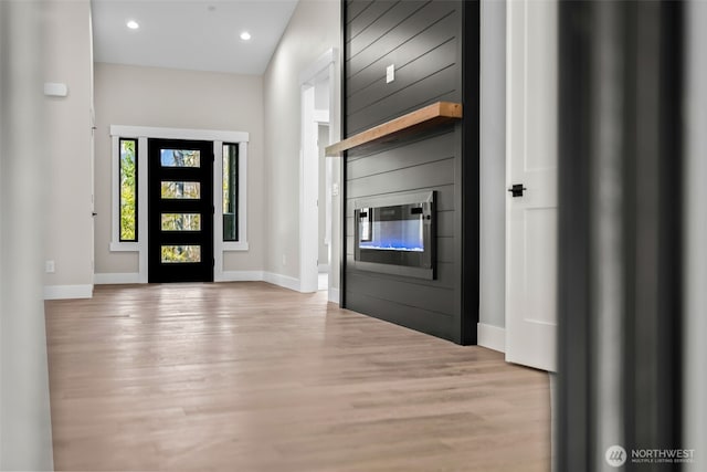 entryway with recessed lighting, baseboards, and wood finished floors