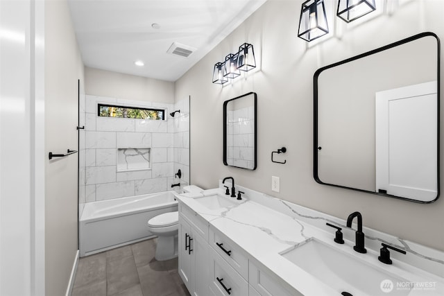 full bathroom featuring double vanity, toilet, visible vents, and a sink