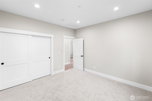 unfurnished bedroom featuring recessed lighting, carpet, and baseboards