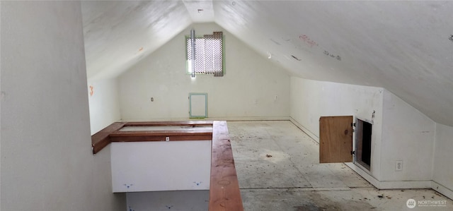 bonus room featuring lofted ceiling