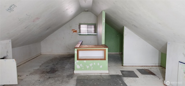 bonus room featuring lofted ceiling