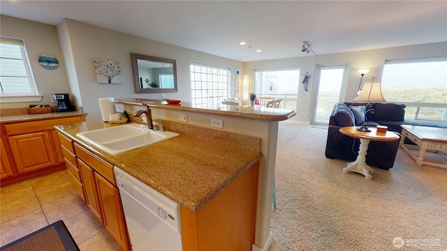 kitchen with open floor plan, a center island with sink, recessed lighting, white dishwasher, and a sink