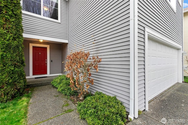 entrance to property featuring a garage