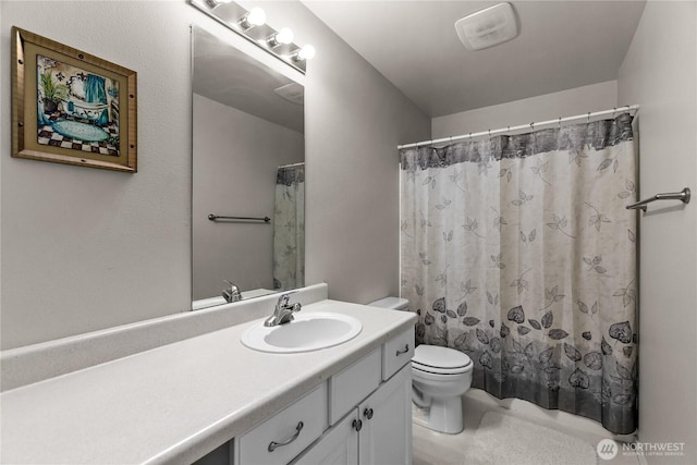 bathroom featuring visible vents, vanity, toilet, and a shower with curtain