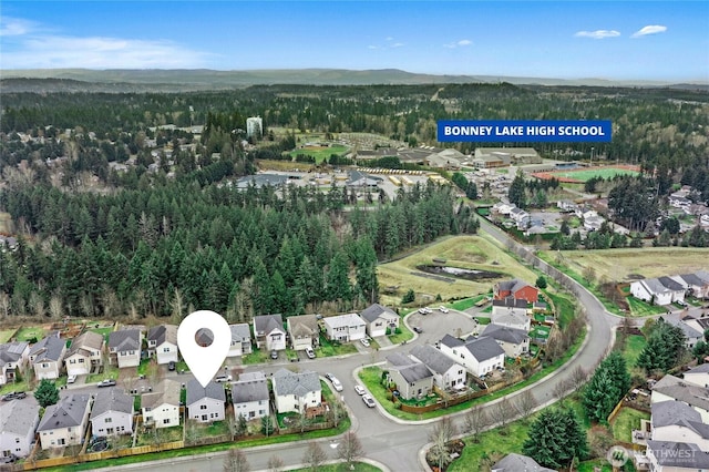 bird's eye view with a forest view and a residential view