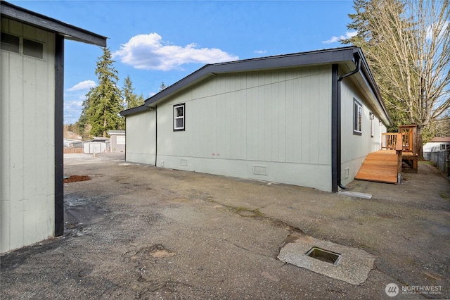 view of side of home with crawl space