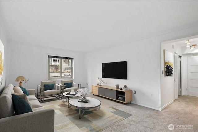 living room featuring baseboards and carpet