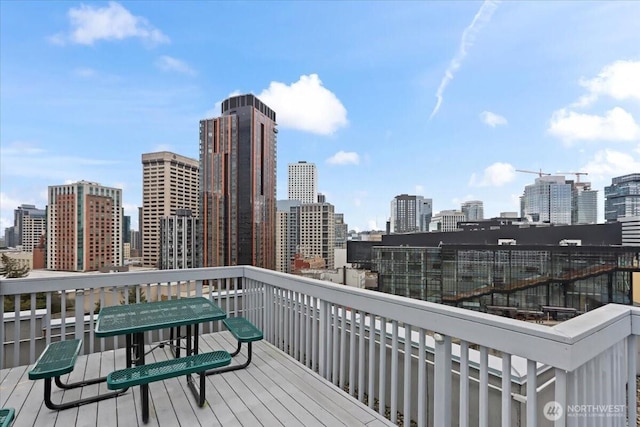 wooden deck featuring a city view