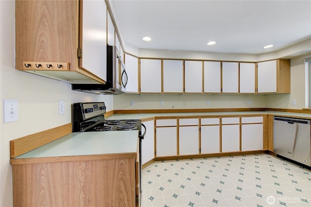 kitchen with white cabinetry, light countertops, recessed lighting, and stainless steel appliances