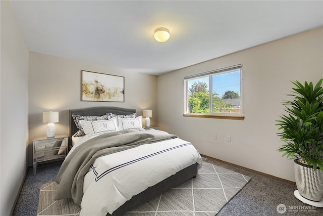 carpeted bedroom with baseboards