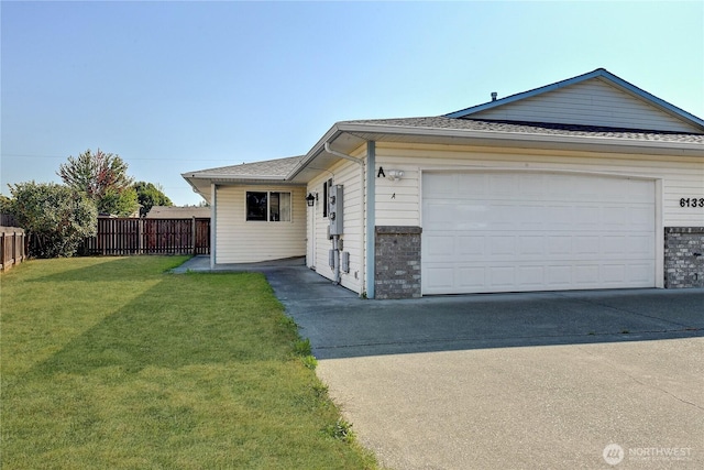 ranch-style home with fence, driveway, a front lawn, a garage, and brick siding