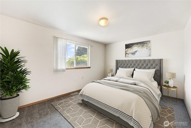 carpeted bedroom with visible vents and baseboards