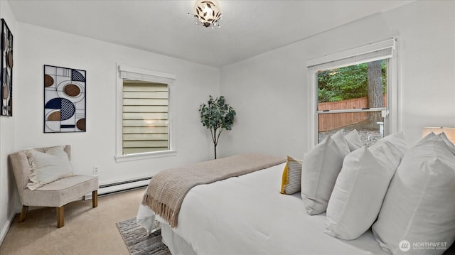 carpeted bedroom featuring a baseboard heating unit