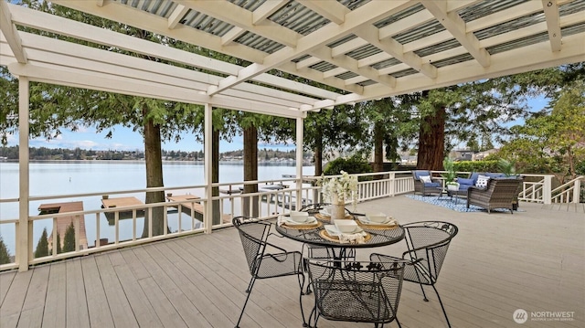 wooden terrace with an outdoor living space, a water view, and a pergola