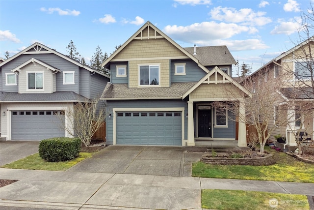 view of front of house with concrete driveway, an attached garage, and a shingled roof