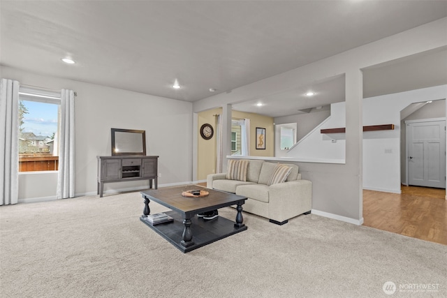 living area featuring carpet flooring, recessed lighting, and baseboards