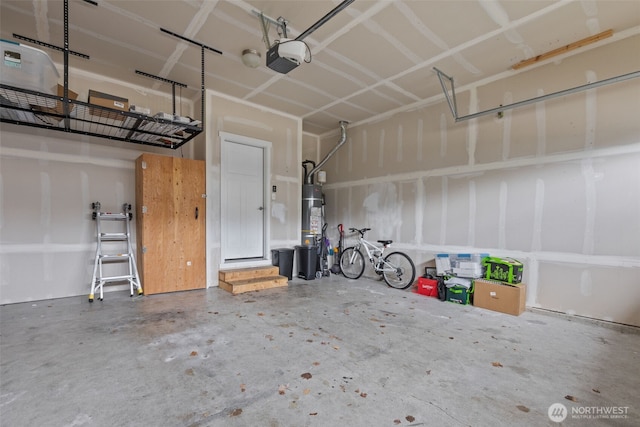 garage with water heater and a garage door opener