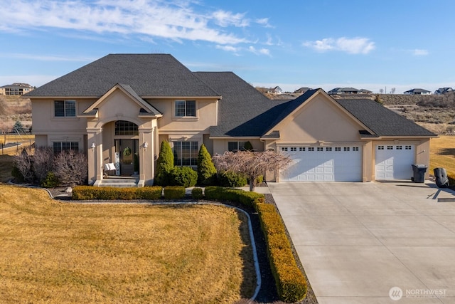 view of front of house featuring stucco siding, driveway, a front lawn, an attached garage, and a shingled roof