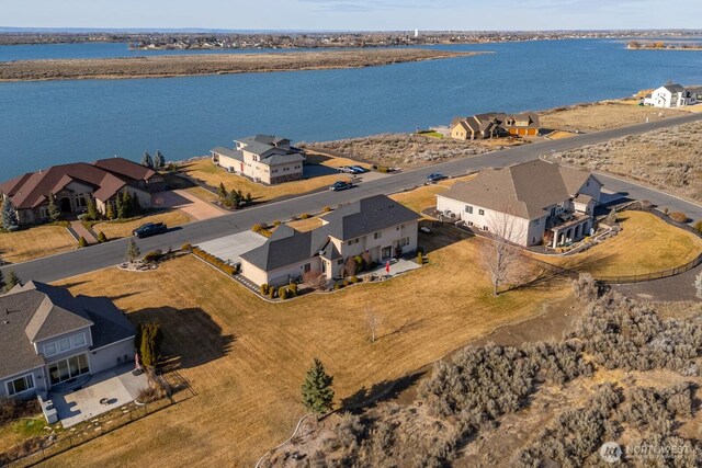 aerial view featuring a residential view and a water view