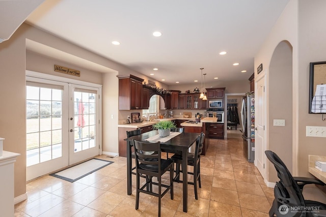 dining space featuring light tile patterned floors, recessed lighting, french doors, and baseboards