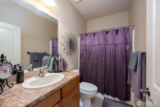 full bath with tile patterned floors, curtained shower, toilet, and vanity