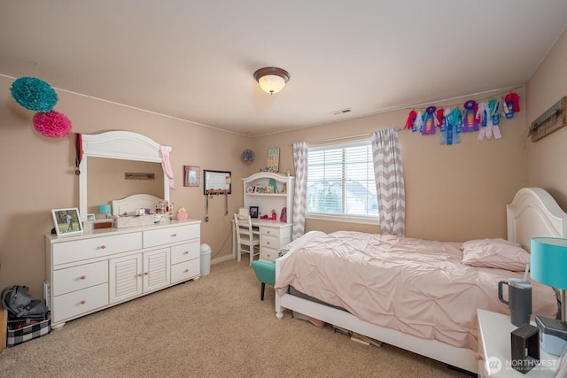 bedroom with visible vents and light colored carpet