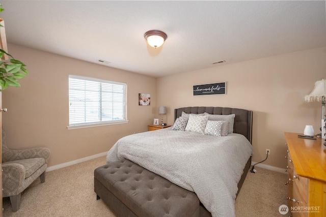 bedroom with carpet flooring, baseboards, and visible vents