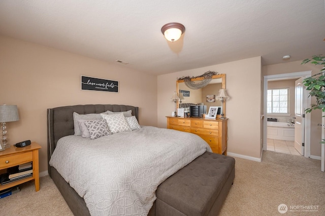 bedroom with light carpet, visible vents, and baseboards