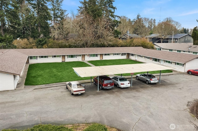 covered parking lot with a residential view