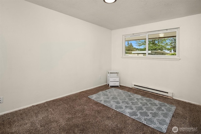 spare room with a baseboard heating unit, carpet flooring, a textured ceiling, and baseboards