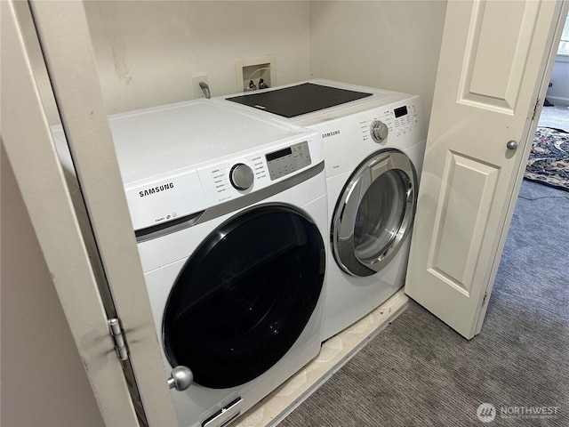 washroom with laundry area, washing machine and clothes dryer, and light colored carpet