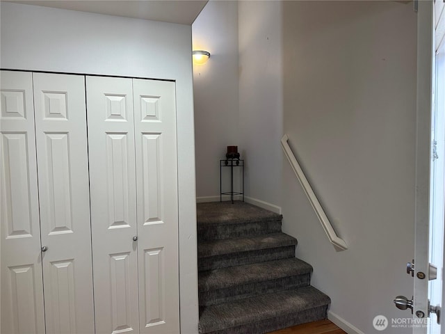 stairway featuring baseboards