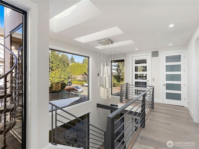 6413 Lake Washington Blvd NE, Kirkland, WA 98033 - interior space featuring wood finished floors, a skylight, recessed lighting, and baseboards