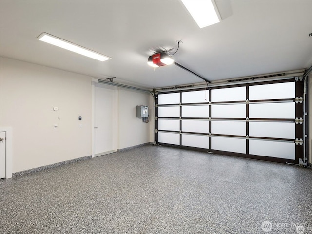 6413 Lake Washington Blvd NE, Kirkland, WA 98033 - garage with a garage door opener and baseboards