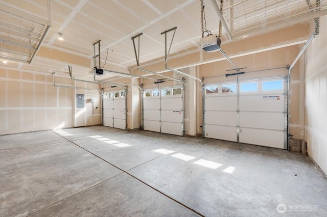 garage with electric panel and a garage door opener