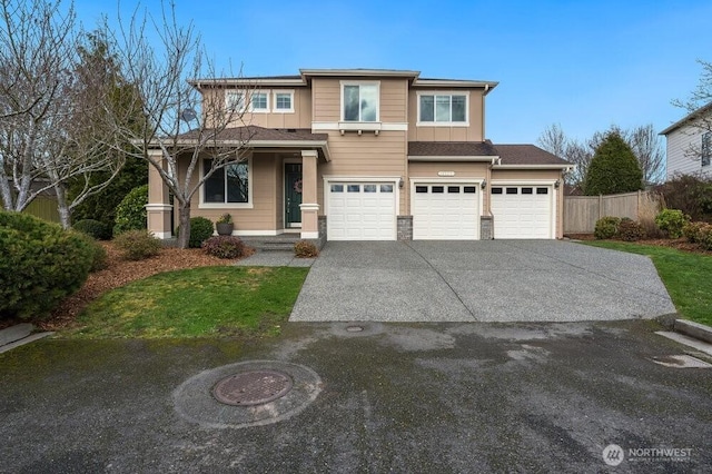 view of front of property with board and batten siding, concrete driveway, a garage, and fence