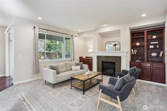 living room with light colored carpet, a fireplace, recessed lighting, and baseboards