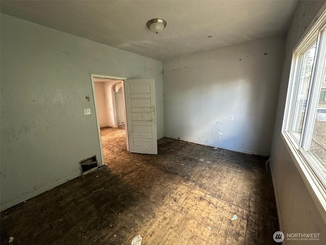 unfurnished bedroom featuring visible vents