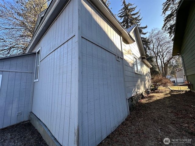 view of side of property with crawl space