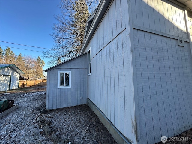 view of property exterior with fence