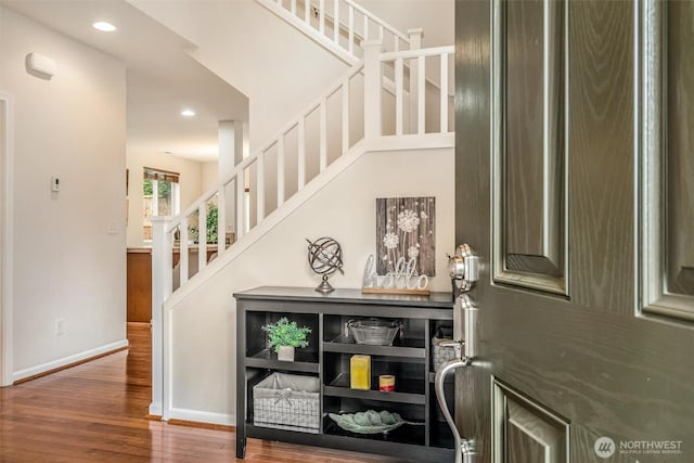 entrance foyer featuring stairs, recessed lighting, wood finished floors, and baseboards